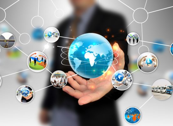 Professional holding globe representing worldwide moving and logistics services