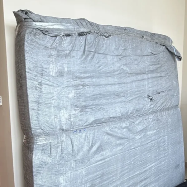 Mattress securely wrapped in protective cover for safe moving Dubai